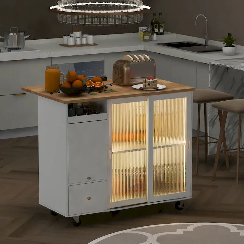 Îlot de cuisine mobile avec plateau rabattable, éclairage LED, portes en verre cannelé, étagère réglable et deux tiroirs
